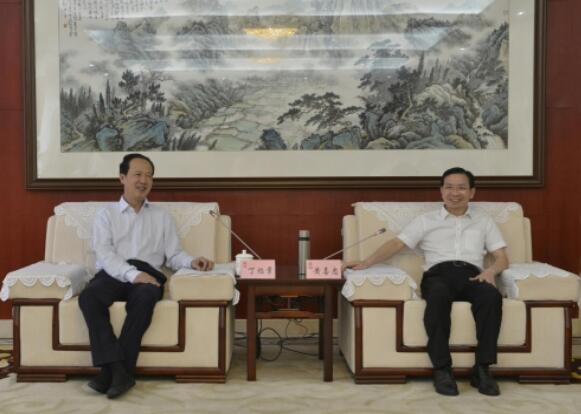 丁焰章拜會南昌市委副書記、市長黃喜忠